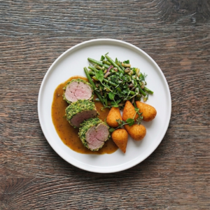 Schweinsfilet im Kräutermantel